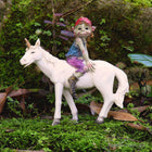 Pixie boy Sitting on a Unicorn Friend