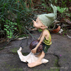 Naughty Pixie trying to Pull the Shell off a Snail