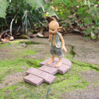 Pixie Boy confused whilst Playing Hopscotch