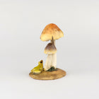 Frog looking up to a Lady Bug on top of a Mushroom
