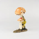 Frog Climbing up a  Mushroom with Lady Bug