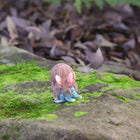 Cute Fairy Sitting with Hands on Her Knees