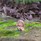 Cute Fairy Sitting with Hands on Her Knees