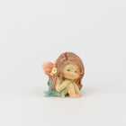 Cute Fairy Sitting with Hands on Her Knees