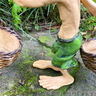 Larger Pixie Carrying Two Baskets on a Tree Branch