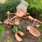 Larger Pixie Carrying Two Baskets on a Tree Branch