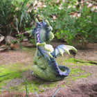 Dragon holding a Clear White Rock 12cm