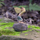 Pixie Attempting to Fly using a Couple of Leaves