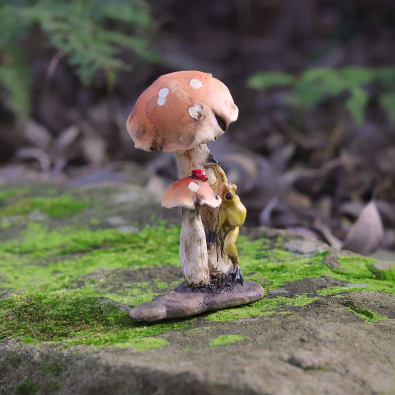 Frog Climbing up a  Mushroom with Lady Bug