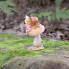 Cute little Fairy Child Asleep on a Mushroom with a little Snail Friend